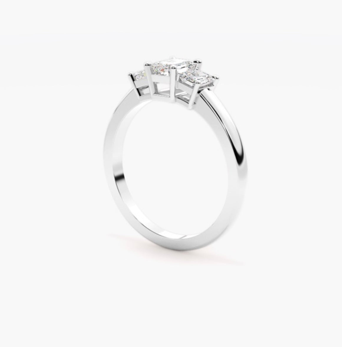 0.75ct Emerald Cut Lab Grown Diamond Trilogy Engagement Ring with Emerald Side Stones – IGI Certified