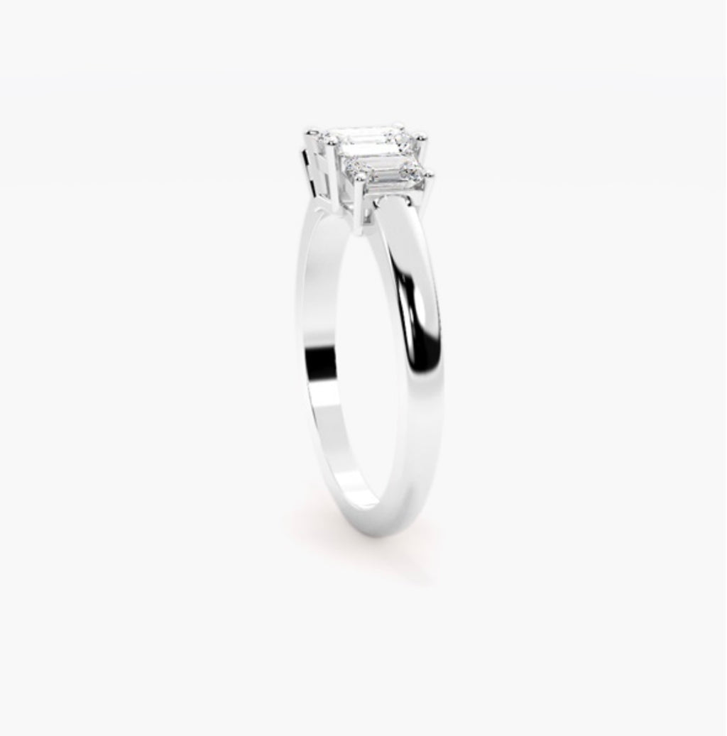 0.75ct Emerald Cut Lab Grown Diamond Trilogy Engagement Ring with Emerald Side Stones – IGI Certified