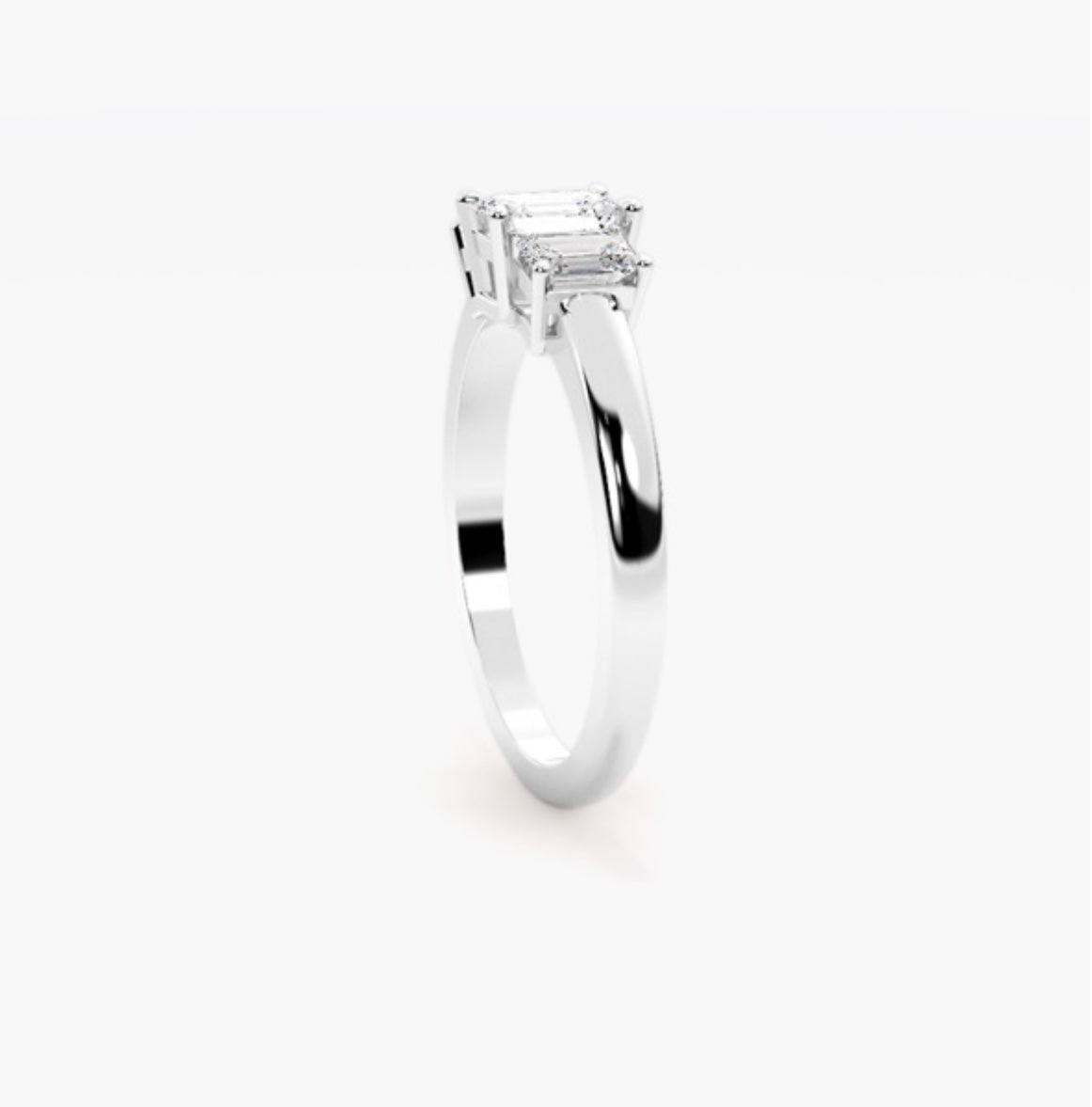 0.75ct Emerald Cut Lab Grown Diamond Trilogy Engagement Ring with Emerald Side Stones – IGI Certified